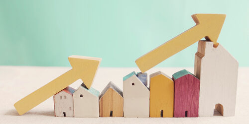 Wooden,Houses,With,Yellow,Arrows,Up.,Housing,Boom,,Property,Market