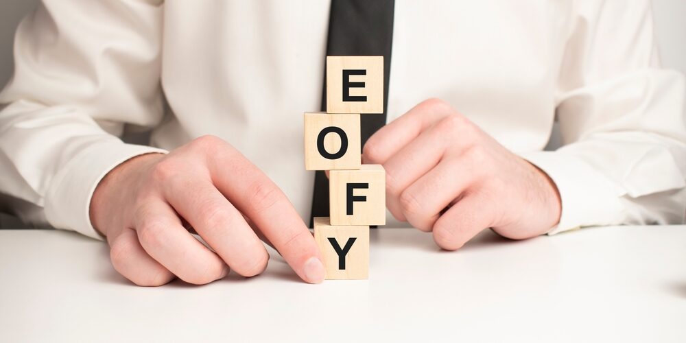 On,A,Light,Pink,Background,,Multi-colored,Wooden,Cubes,With,The