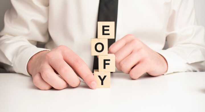 On,A,Light,Pink,Background,,Multi-colored,Wooden,Cubes,With,The