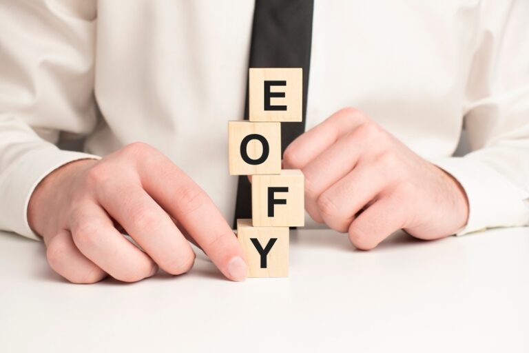 On,A,Light,Pink,Background,,Multi-colored,Wooden,Cubes,With,The