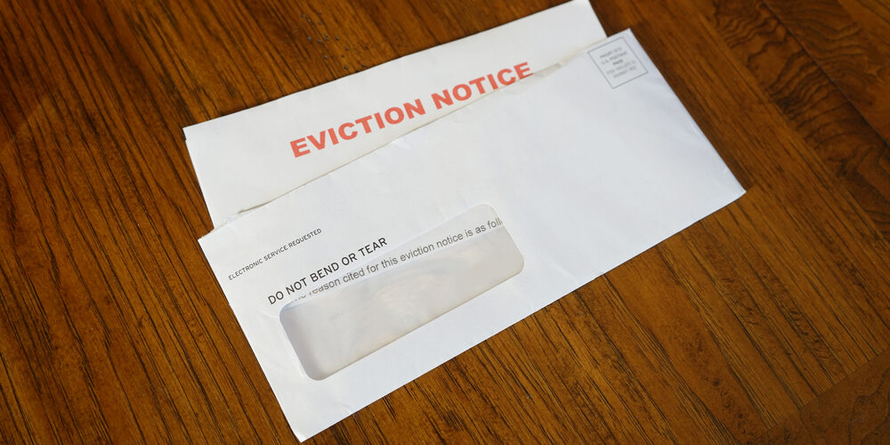 Close-up,Of,An,Eviction,Notice,In,Envelope,On,Desk