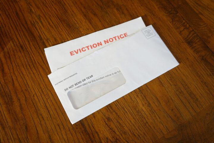Close-up,Of,An,Eviction,Notice,In,Envelope,On,Desk